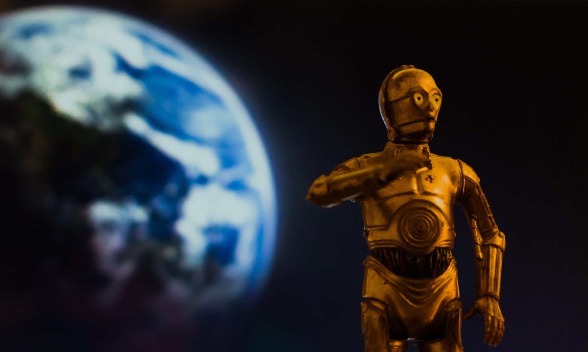 C3PO toy with planet in the background